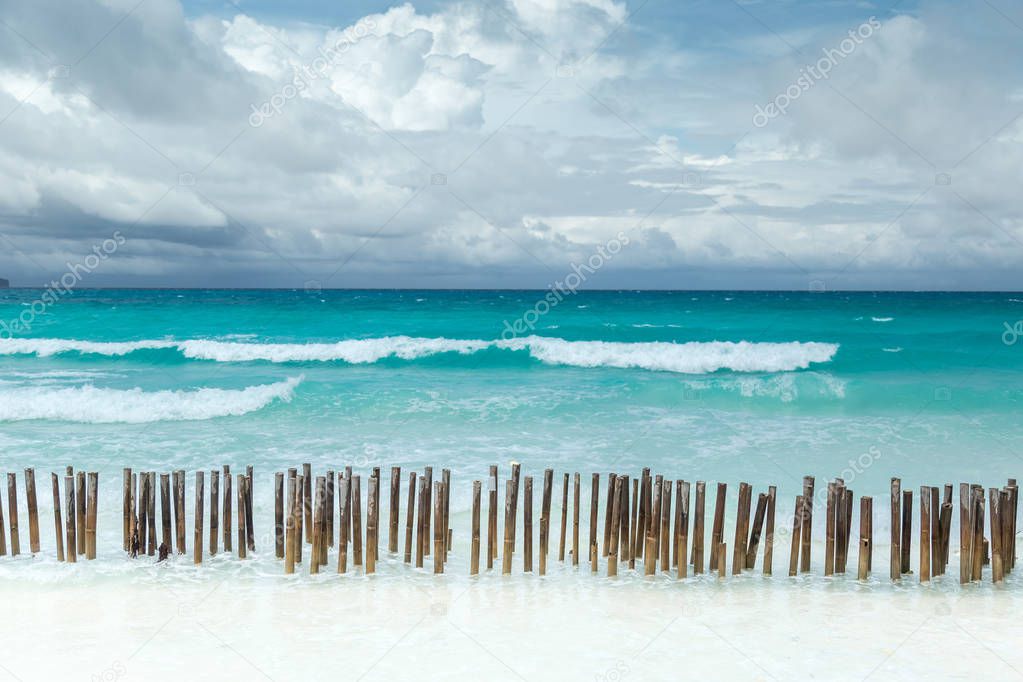 Tropical seascape with turquoise azure sea and white sandy beach in Boracay, Philippines