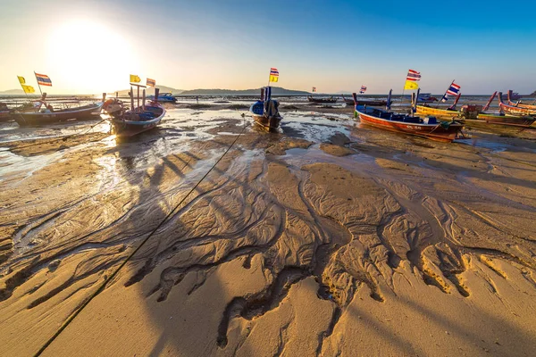 Fishing boats at low tide on the Chalong beach at sunrise time, Phuket, Thailand — Stock Photo, Image