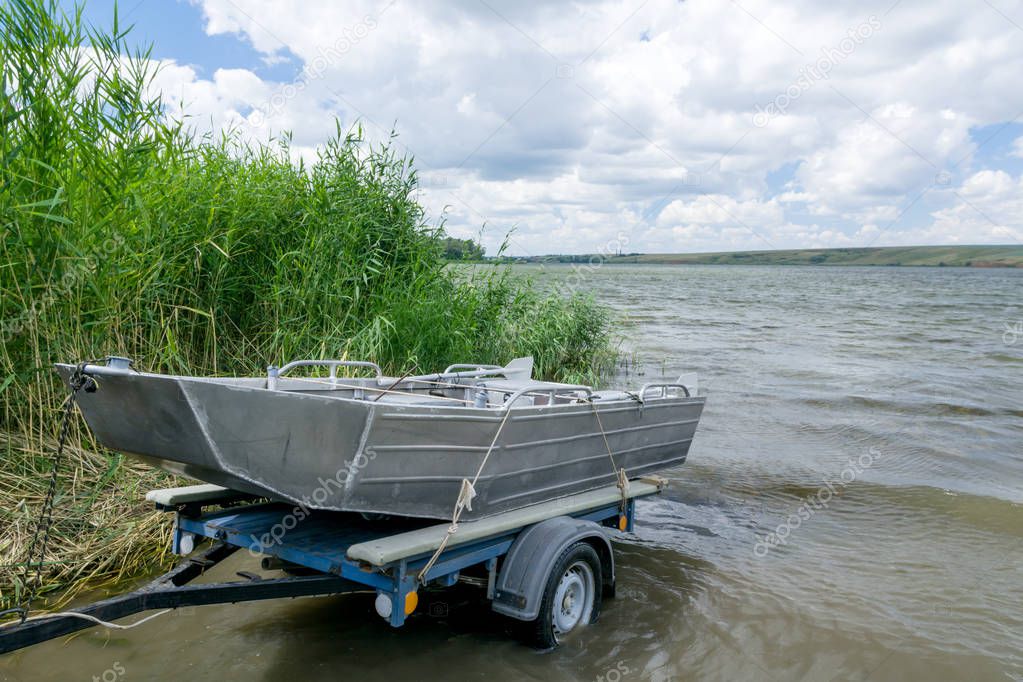 transportation of the boat on the trailer and descent in the water