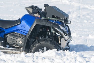 front wheel of Quad bike in the snow
