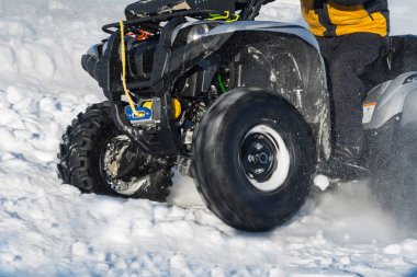 front wheel of Quad bike in the snow