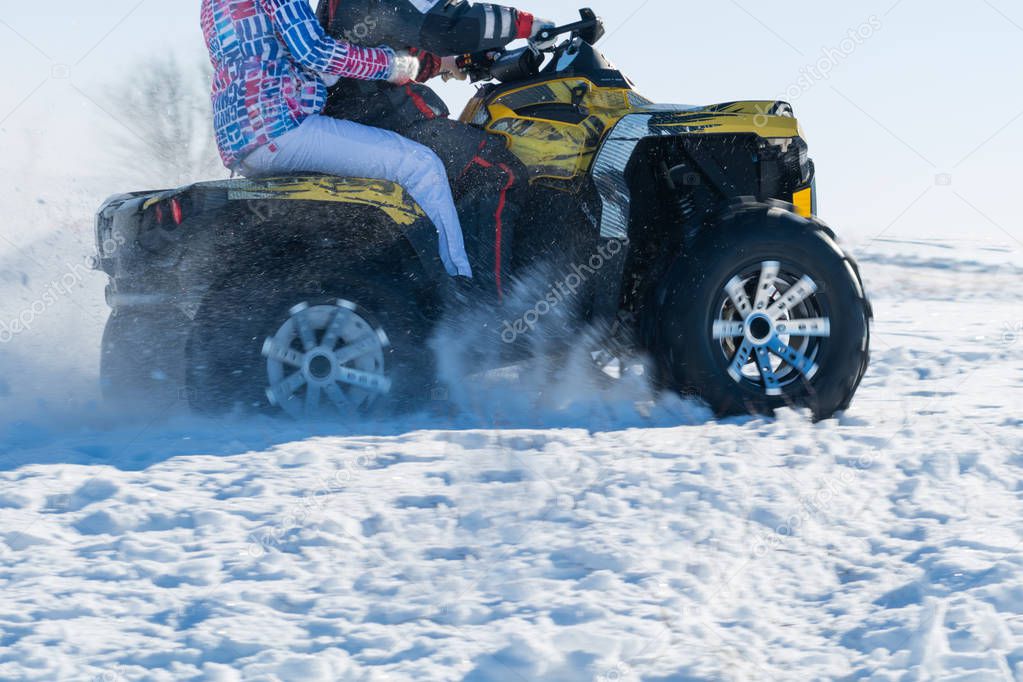 front wheel of Quad bike in the snow