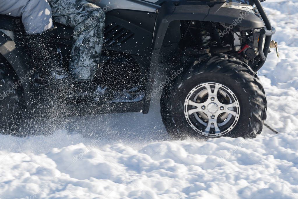 front wheel of Quad bike in the snow