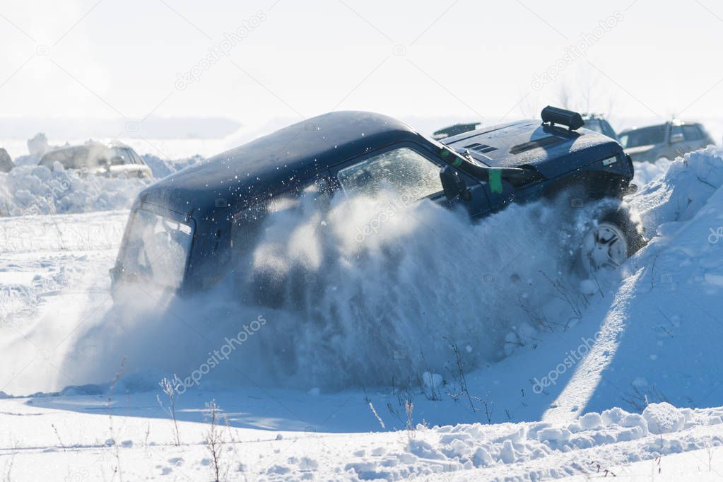 car in the snow in the field