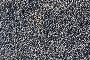 Black polymer plastic granules in bulk clipart