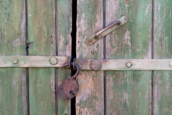 old door with an open padlock