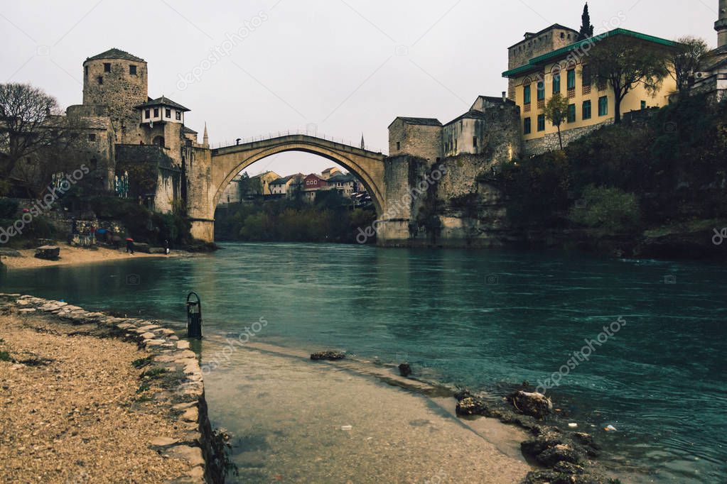 Historic Mostar Bridge on a cloudy day