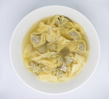 beyaz zemin üzerine sarı wontons