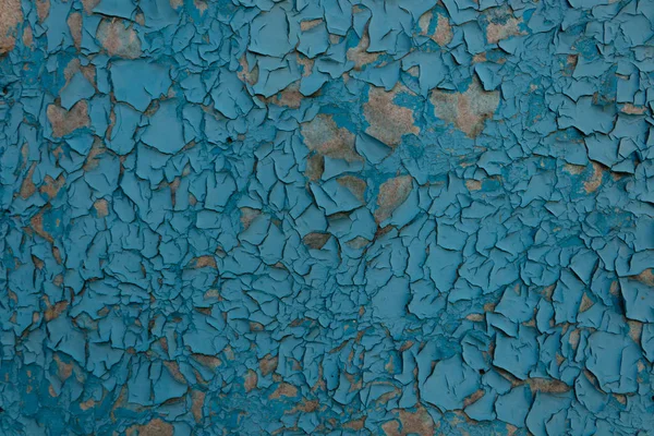 Texture di vecchia vernice blu screpolata e sbucciata su un piatto naturale s — Foto Stock