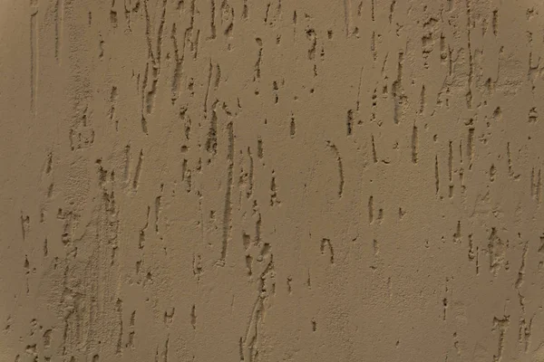 La parete è coperta con malta di cemento con scheggiature artificiali — Foto Stock