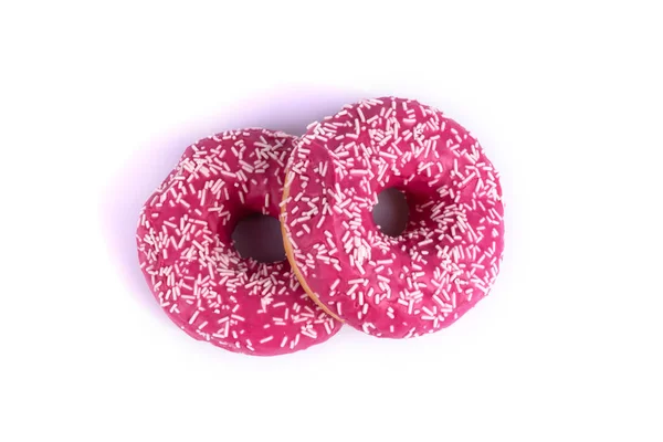 On a white background close-up depicts donuts, one lies on the e — ストック写真