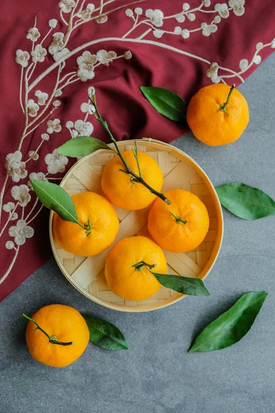 Popular common items and ornaments associated with the festive season. Chinese New Year Decors. Tangerines and red cloth are symbols of good meaning and wealth