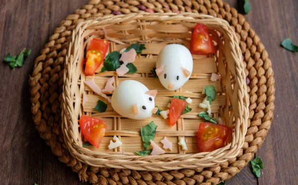 Homemade food craft of animated piggy shape quail eggs in wicker basket