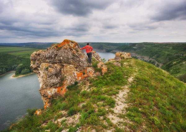 tourist on the rock. girl meditates on nature. canyon of the picturesque river