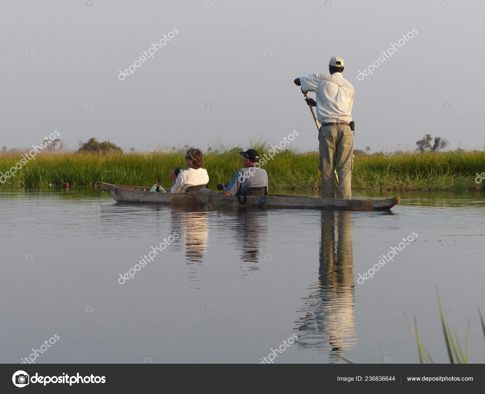 Moremi Botswana August 2013 Back View Tourists Canoeing Safari Guide
