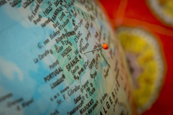 holiday location pinned on a globe