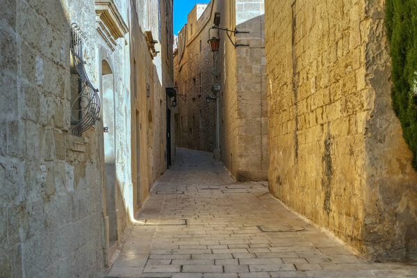 Ancient narrow medieval street in Mdina, Malta