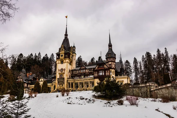 Peles Castle in a cloudy day of winter, the most famous royal castle of Romania, Romanian landmark.