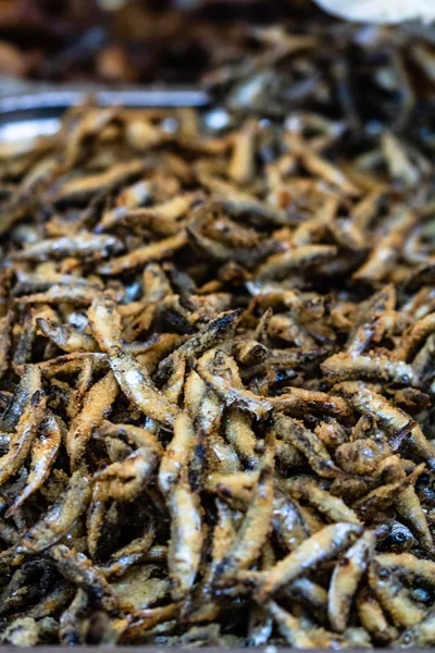 Fried little fish in market or food festival, food truck, food m