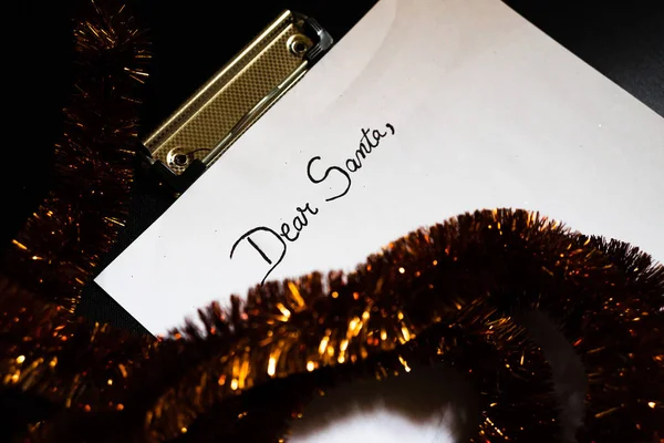 Writing Dear Santa for Christmas. Christmas letter. Text Dear Sa