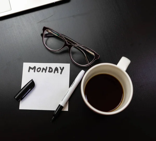 Different objects on black office desk. Modern black office desk — Stock Photo, Image