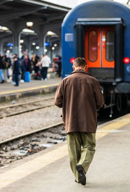 Travelers and commuters on their way to the train platform at Bucharest North Railway Station (Gara de Nord Bucharest) in Bucharest, Romania, 2020