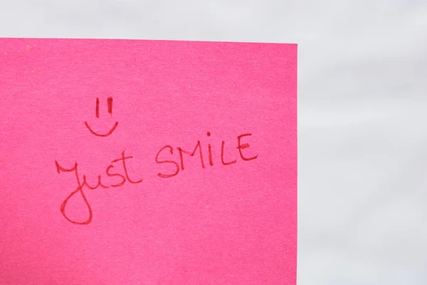 Just Smile Handwriting Text Close Isolated Pink Paper Copy Space — Stock Photo, Image
