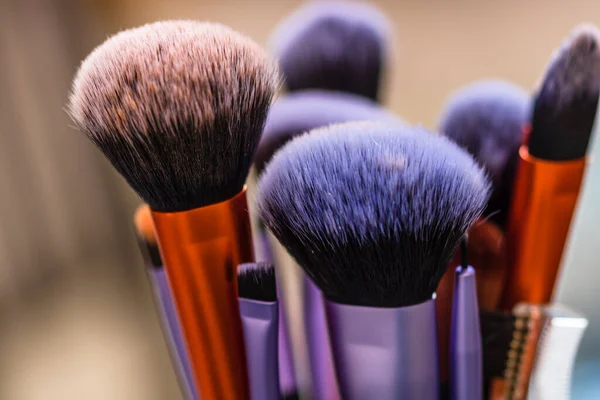 Clean and dirty professional makeup brushes isolated.