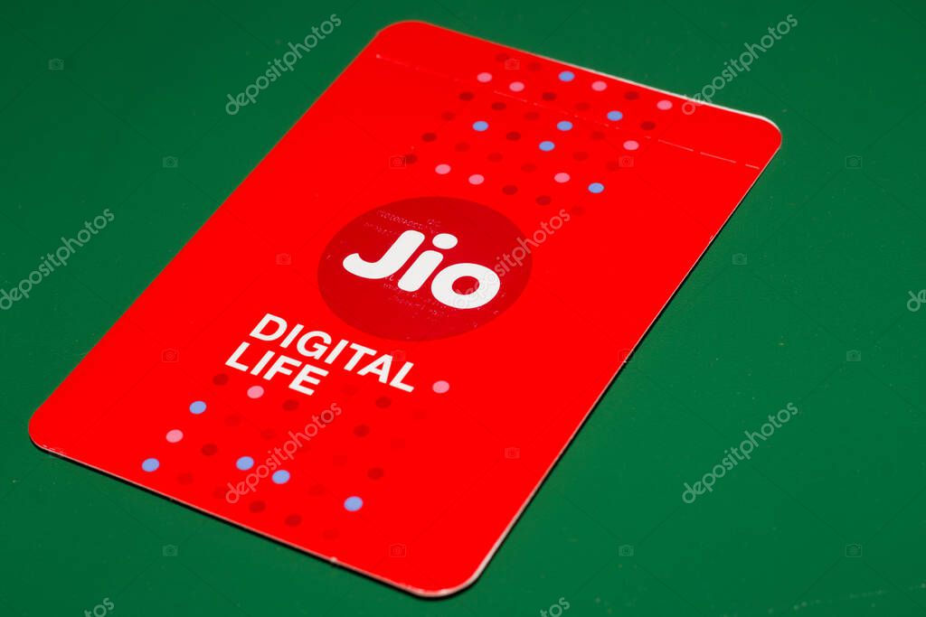 Delhi, India - October 05, 2020 : Jio SIM Cards With Every JioFi or 4G Smartphone with Green Background for text