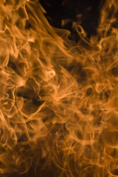 Fiamma astratta di fuoco, fiamma di fuoco texture fiamma per sfondo banner, immagine concettuale di fuoco ardente, particelle di fuoco perfette su uno sfondo nero. Primo piano . — Foto Stock