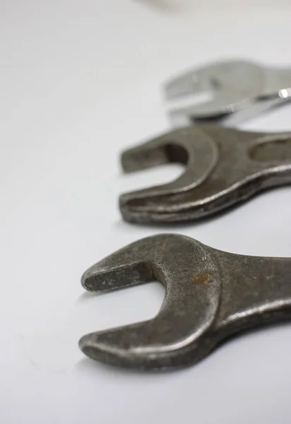 Three old working wrenches on a white background. Work Tool mechanic. Close up — Stock Photo, Image