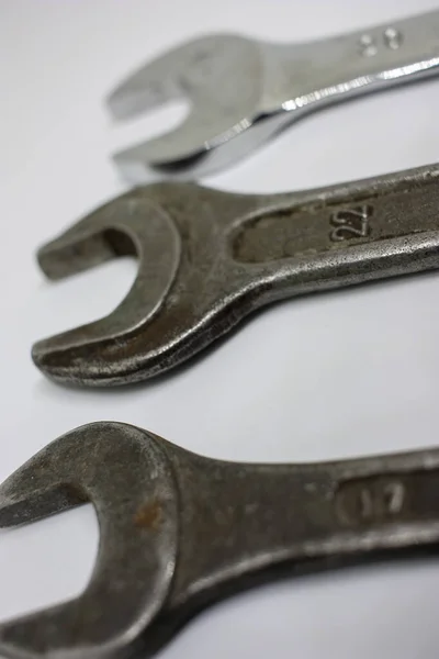 Three old working wrenches on a white background. Work Tool mechanic. Close up — Stock Photo, Image