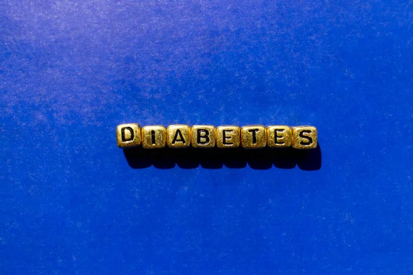 Inscription Diabète Gros Plan Cubes Dorés Fond Bleu Concept Médical — Photo