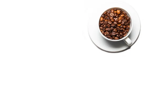 Coffee beans in a white cup isolated on a white background. Top view with place for text.