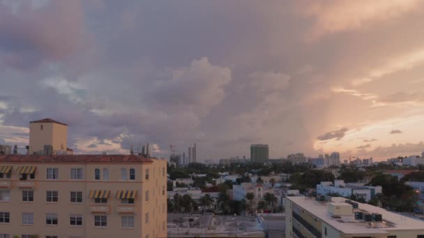 4K air view on Miami South Beach with beautiful pink-purple sunset above — стоковое видео