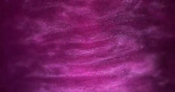 Kunsthintergründe. Pinkfarbene glitzernde Flüssigkeit wirbelt in schönen Wolken — Stockvideo