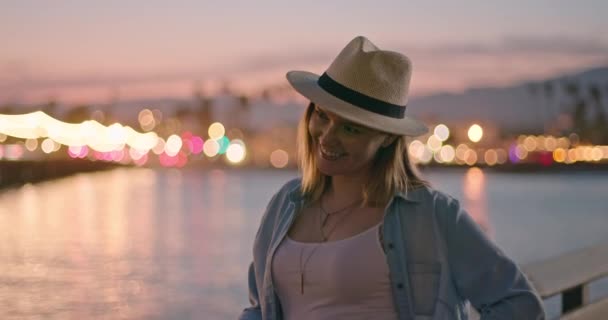 Attractive smiling woman in hat is flirting and looking excited and happy. 4K — Stock Video