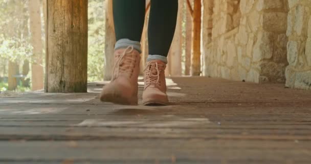 Outdoor adventure and nature travel. Close up woman legs in pink hiking boots 4K — Stock Video