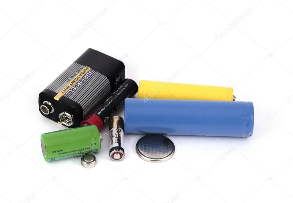 different types of batteries and accumulators color on white background, isolated