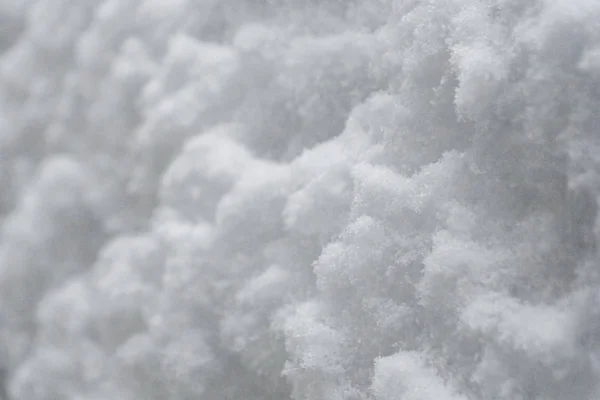 Wintersneeuw. Sneeuwtextuur Bovenaanzicht van de sneeuw. Textuur voor design. Sneeuwwitte textuur. Sneeuwvlokken. — Stockfoto