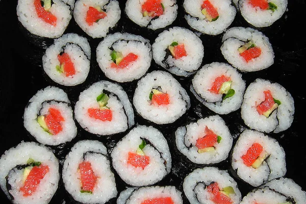 Lots Sushi Rolls Top View Cucumbers Fish — Stock Photo, Image