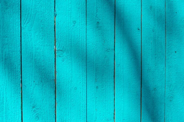 Bright blue wooden planks painted wall