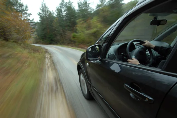 Car driving on country road