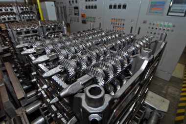 automotive transmission parts on a production line clipart