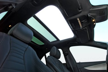 Panoramic sunroof in a passenger car clipart