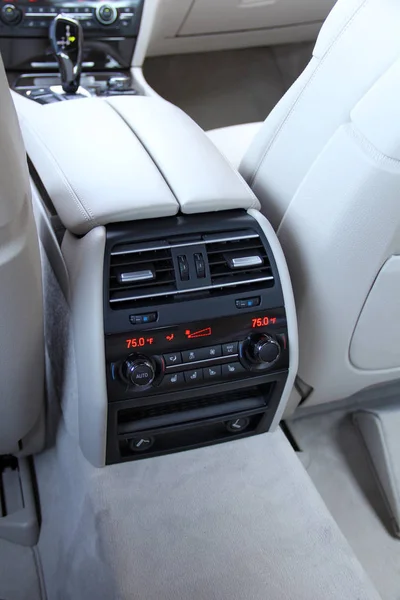 air conditioning controls in the rear seat rear seat in a luxury car