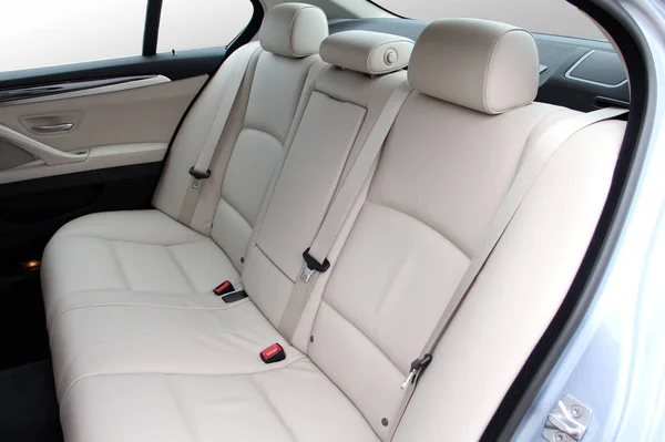 white rear seat of a luxury passenger car