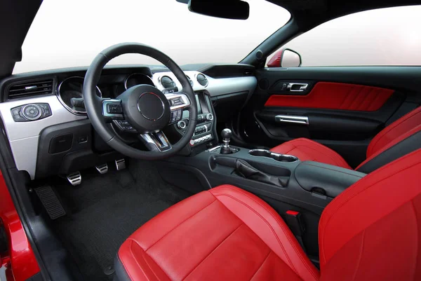red leather interior of luxury red sport car