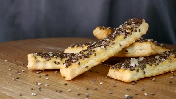 Baked puffy cheese sticks with caraway seeds, poppy seeds, chia seeds and salt