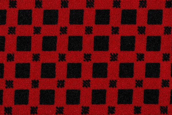 Kare desen arkaplanlı kırmızı pamuk kumaş.